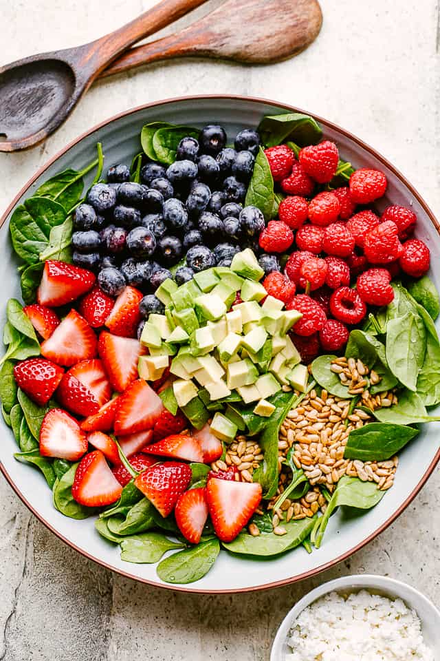 berries on top of spinach