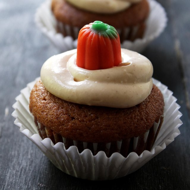 A pumpkin cupcakes filled and frosted with maple cream cheese frosting.