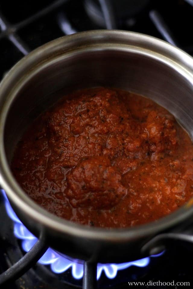 Pasta sauce cooking in a pot on a stove