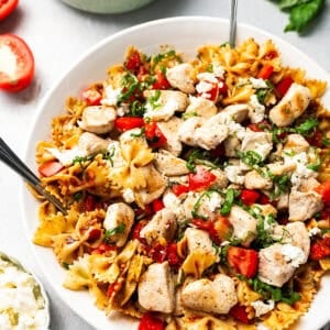 Fully assembled bruschetta chicken Pasta in a large bowl, ready for serving.