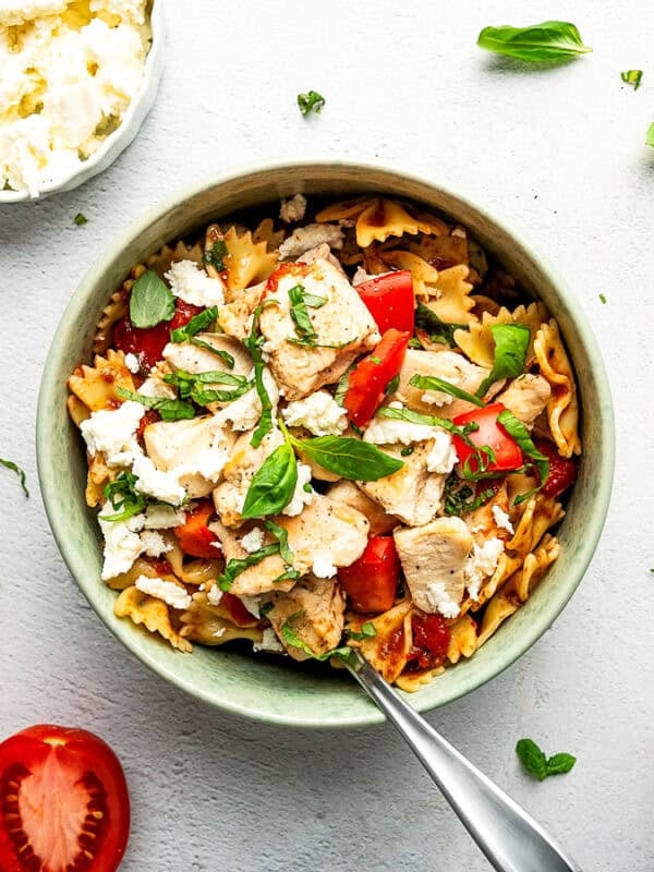 A bowl with a single serving of Chicken Pasta.