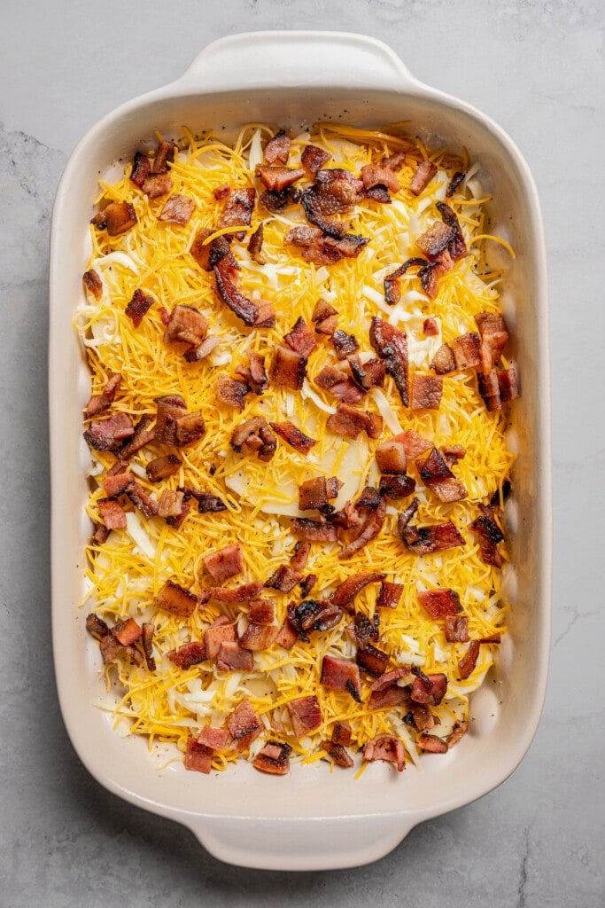 Layered potatoes with cheese and bacon sprinkled on top. 