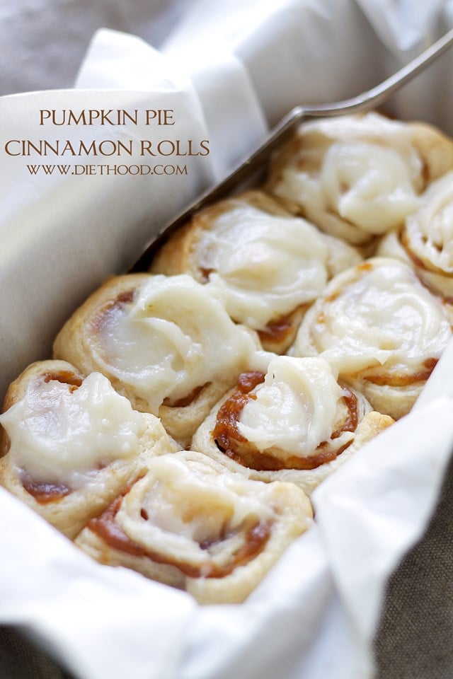 Frosted Pumpkin Pie Cinnamon Rolls IN a baking pan.