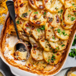 Digging into the cheesy casserole with a spoon.