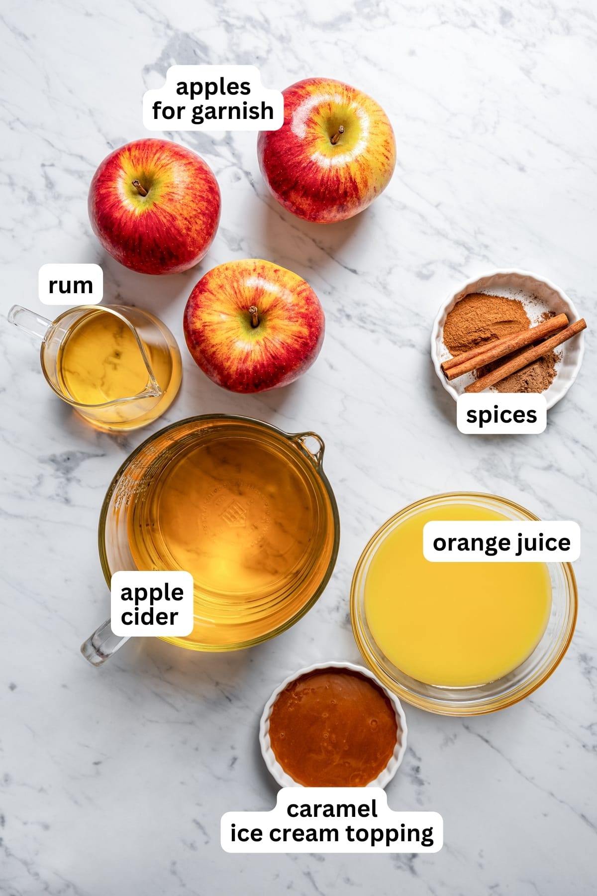 Overhead image of all the ingredients used for spiked apple cider.
