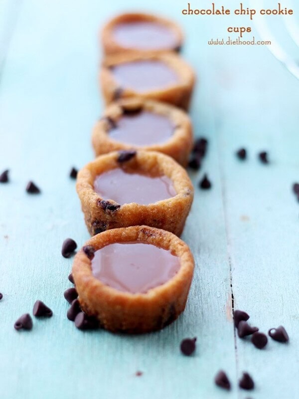 A row of salted caramel cookie cups with chocolate chips.