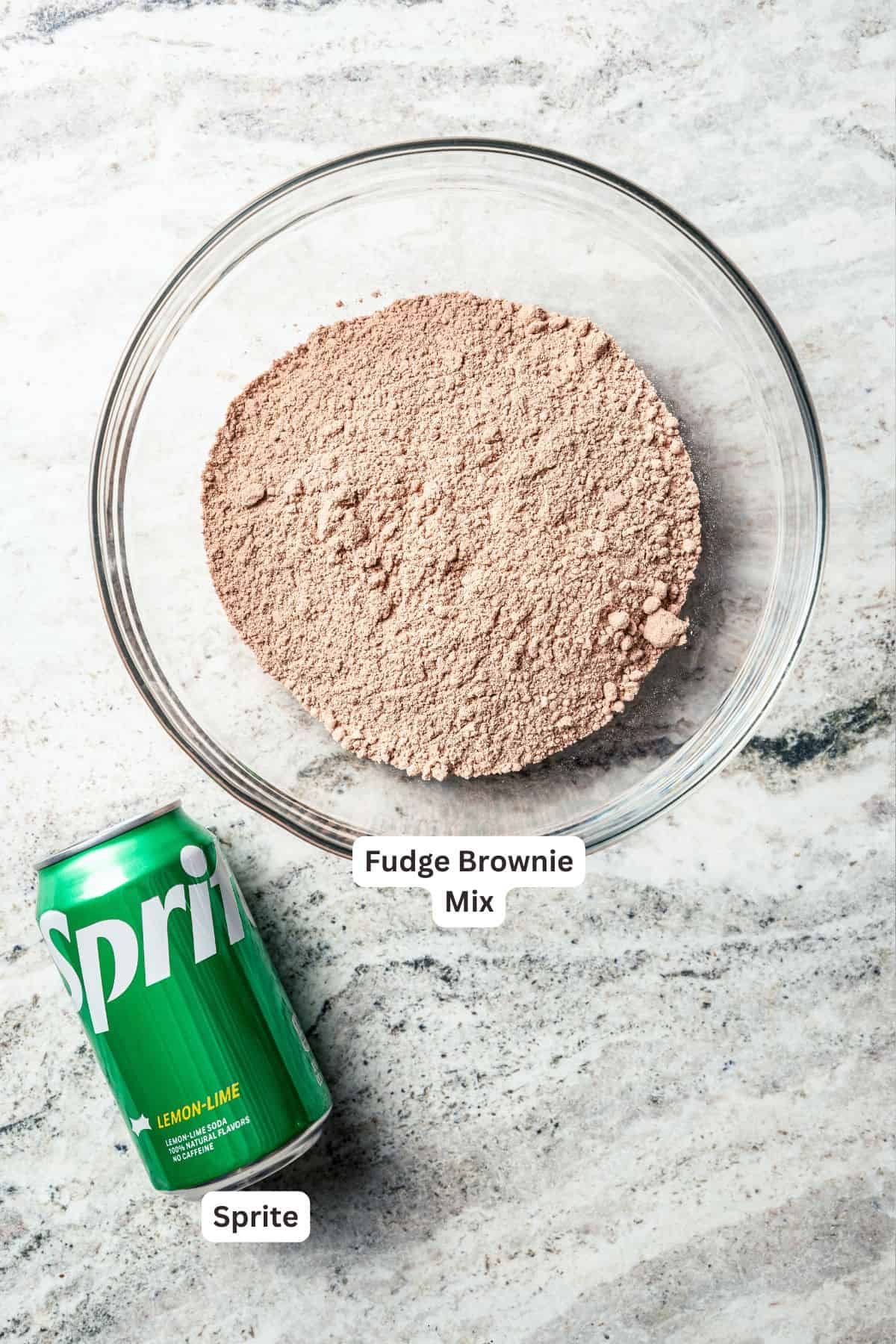 These delicious, moist, fudgy 2-ingredient brownies are made with only a boxed brownie mix and Sprite. That's it! The easiest dessert ever. The cake mix and a can of Sprite needed to make 2-ingredient brownies, with text labels over each ingredient.