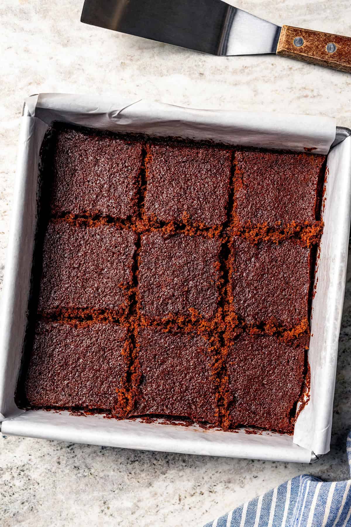 These delicious, moist, fudgy 2-ingredient brownies are made with only a boxed brownie mix and Sprite. That's it! The easiest dessert ever. Two Ingredient Brownies in a brownie pan.