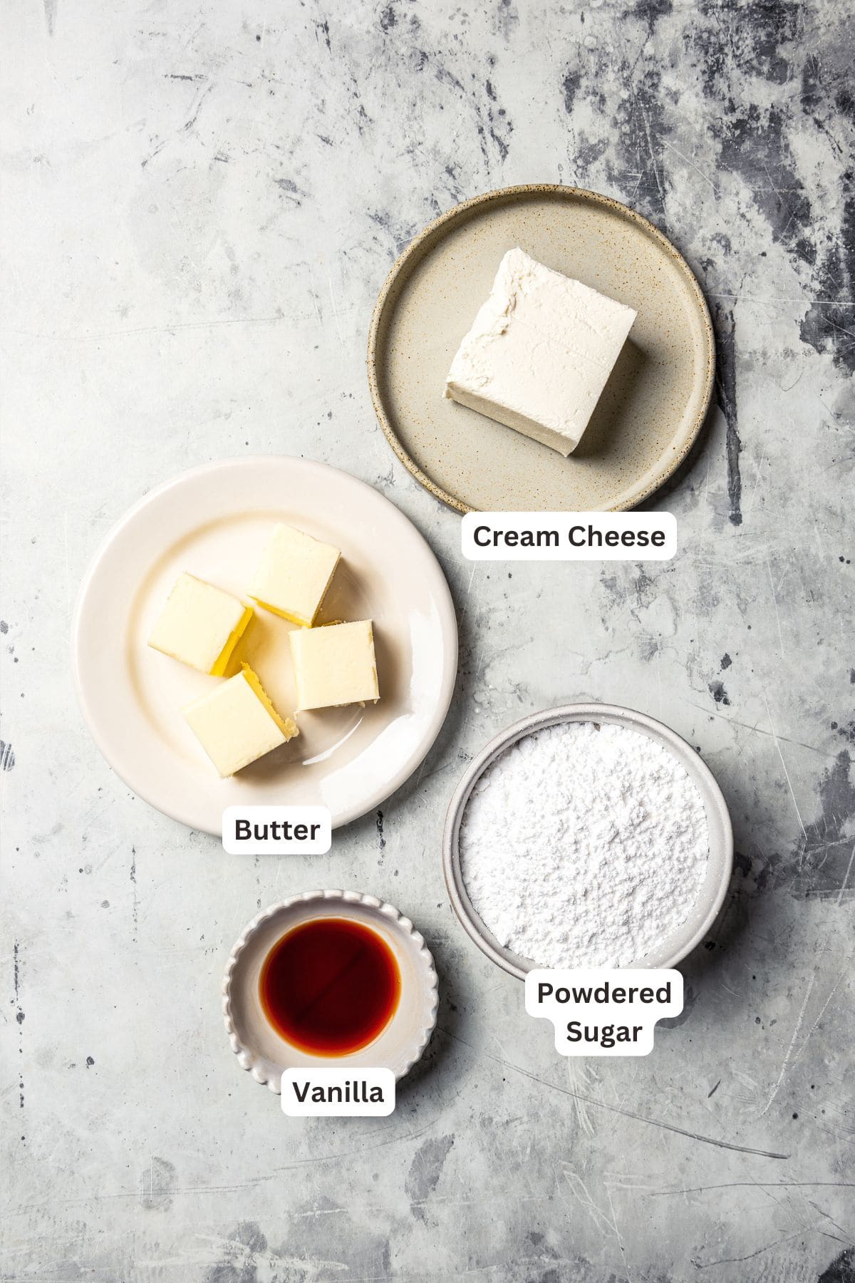 These sweet and gooey homemade caramel rolls require no yeast, rise time, or kneading. They're easy, quick, and best of all, delicious! Cream cheese frosting ingredients with text labels overlaying each ingredient.