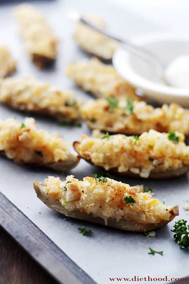Garlicky Cheesy Crispy Potato Skins | www.diethood.com | Garlicky and Cheesy Crispy Potato Skins topped with three cheeses, sour cream, crushed croutons and green onions. | #recipe #appetizers #potatoskins