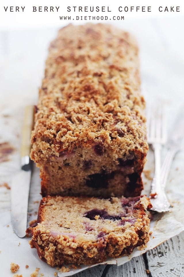 A Coffee Cake that has been sliced so you can see the berries in the middle