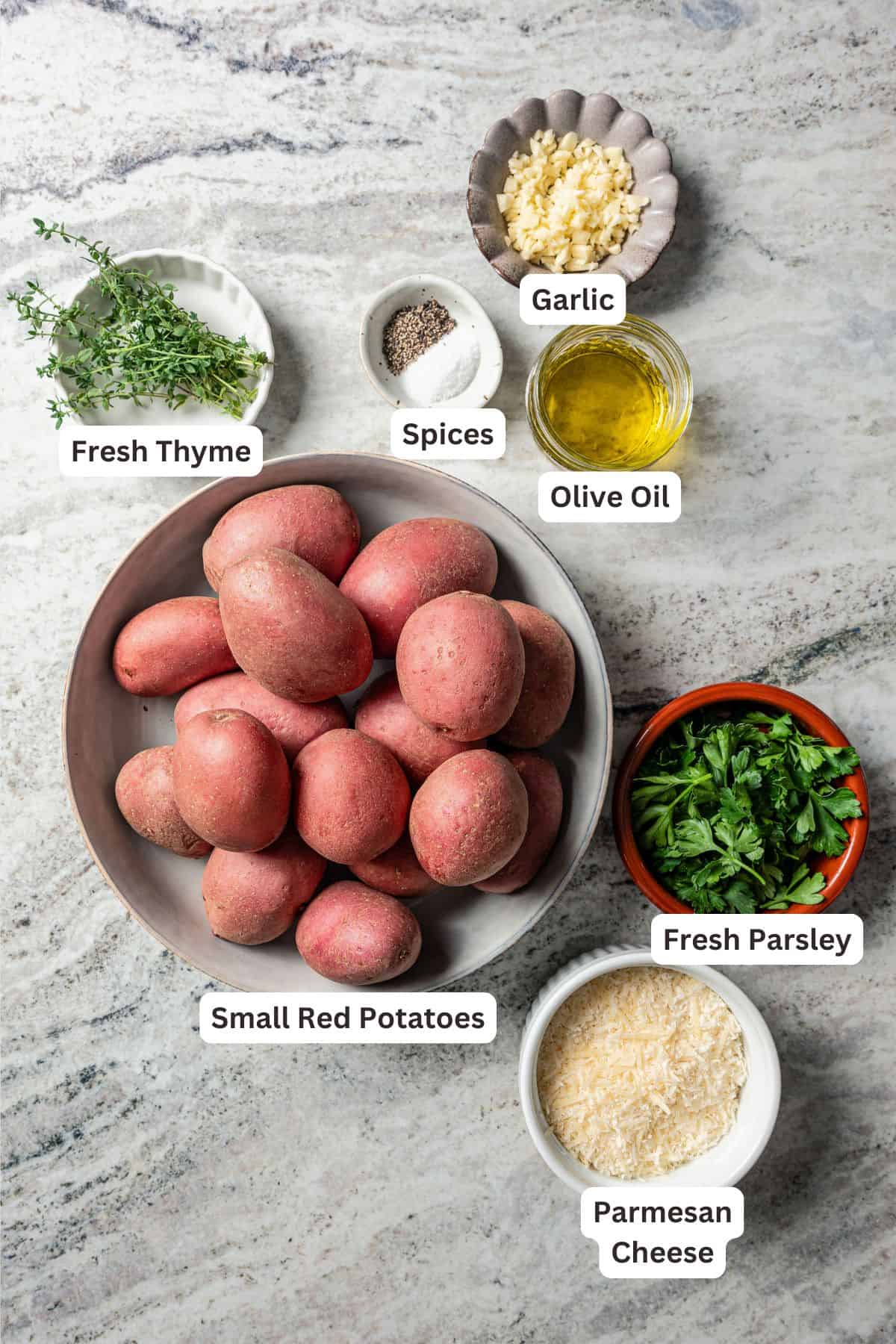 Ingredients for garlic parmesan roasted potatoes with text labels overlaying each ingredient.