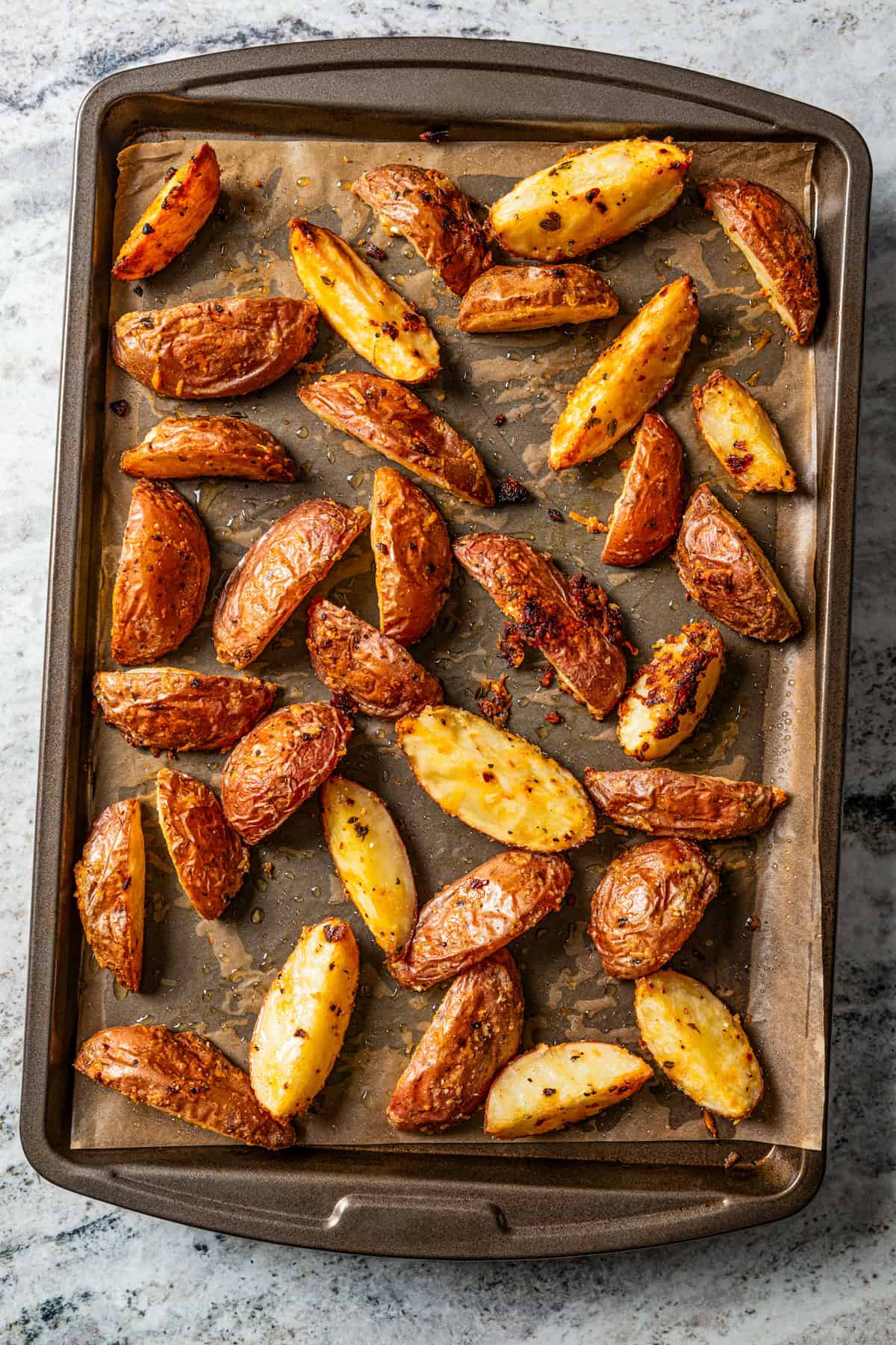 Roasted potatoes on a baking sheet.