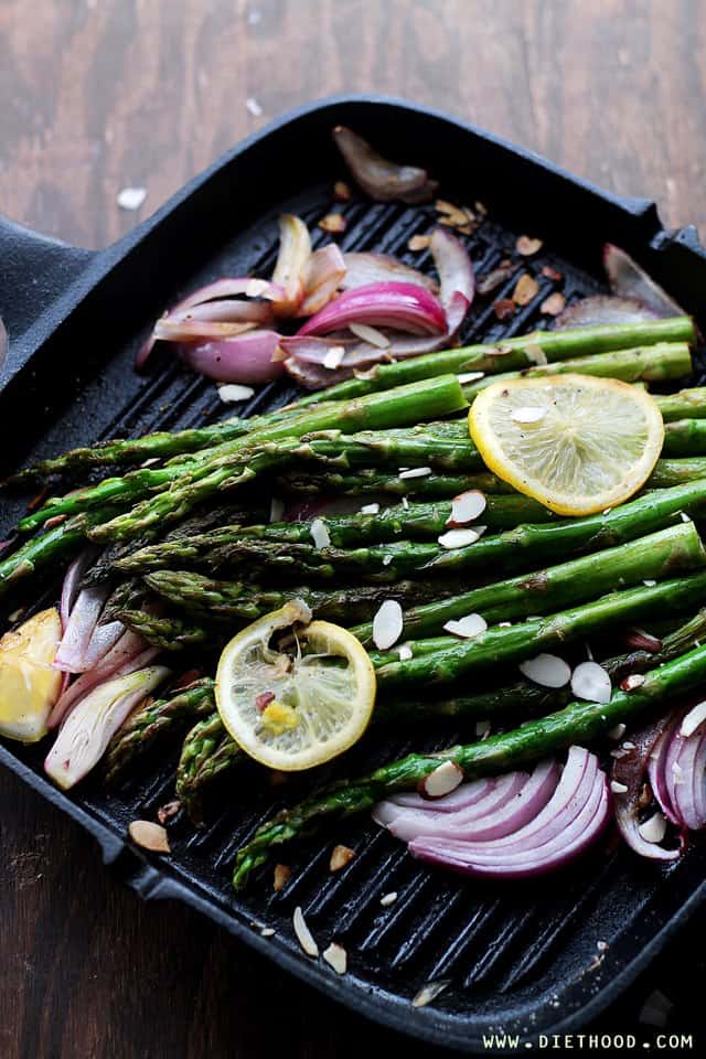 Sauteed asparagus with lemon slices and red onion.