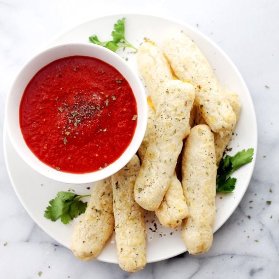 Baked Mozzarella Sticks | www.diethood.com | Baked Mozzarella Sticks made with a mixture of butter, flour, and shredded part-skim mozzarella, served with warmed marinara dipping sauce. | #recipe #appetizers