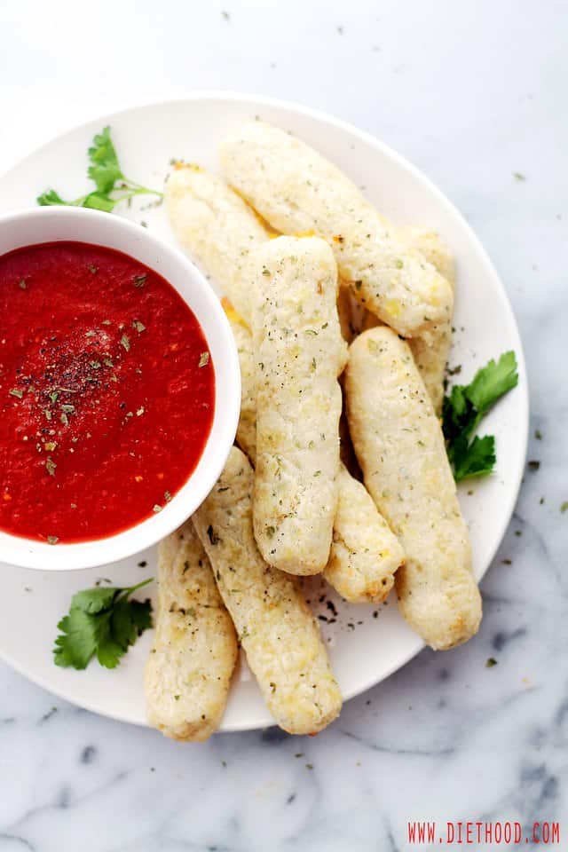 Baked Mozzarella Sticks | www.diethood.com | Baked Mozzarella Sticks made with a mixture of butter, flour, and shredded part-skim mozzarella, served with warmed marinara dipping sauce. | #recipe #appetizers