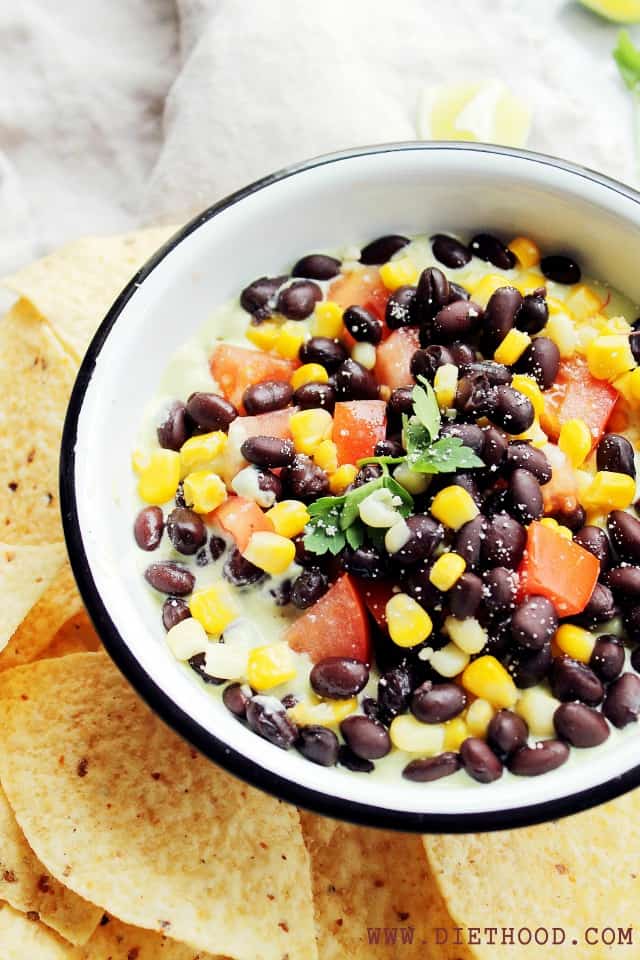 Southwestern Avocado Dip at Diethood | www.diethood.com | Layered Southwestern Avocado Dip made with a smooth avocado mixture, black beans, sweet corn and tomatoes. | #recipe #avocados #appetizer