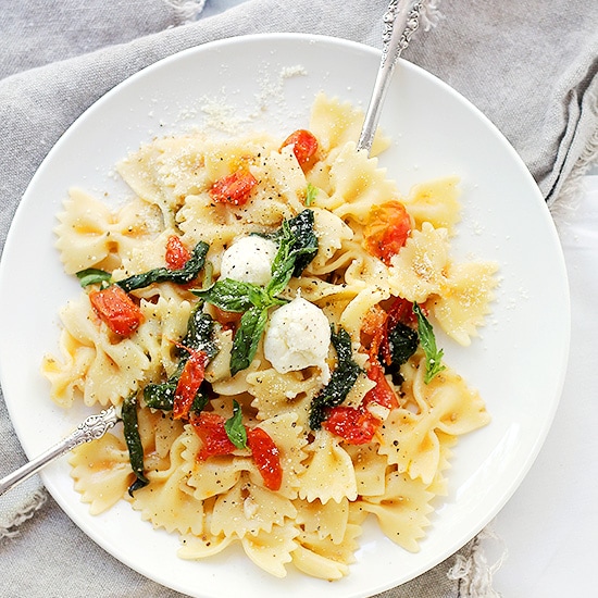  Caprese Pasta on a white plate with forks