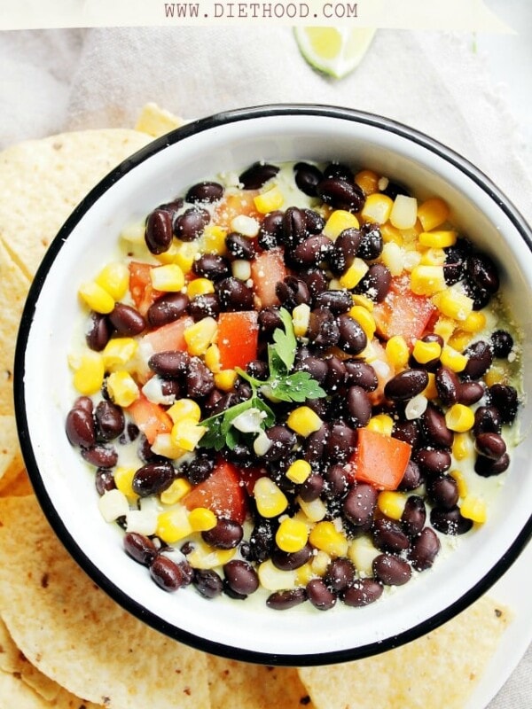 Southwestern Avocado Dip at Diethood | www.diethood.com | Layered Southwestern Avocado Dip made with a smooth avocado mixture, black beans, sweet corn and tomatoes. | #recipe #avocados #appetizer