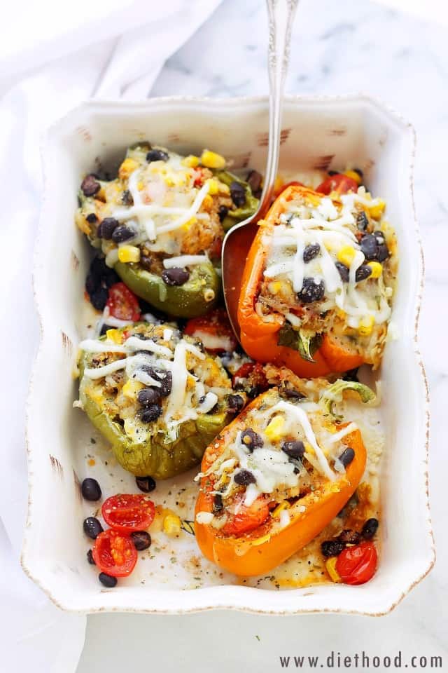 Southwestern Quinoa Stuffed Peppers in a white baking dish
