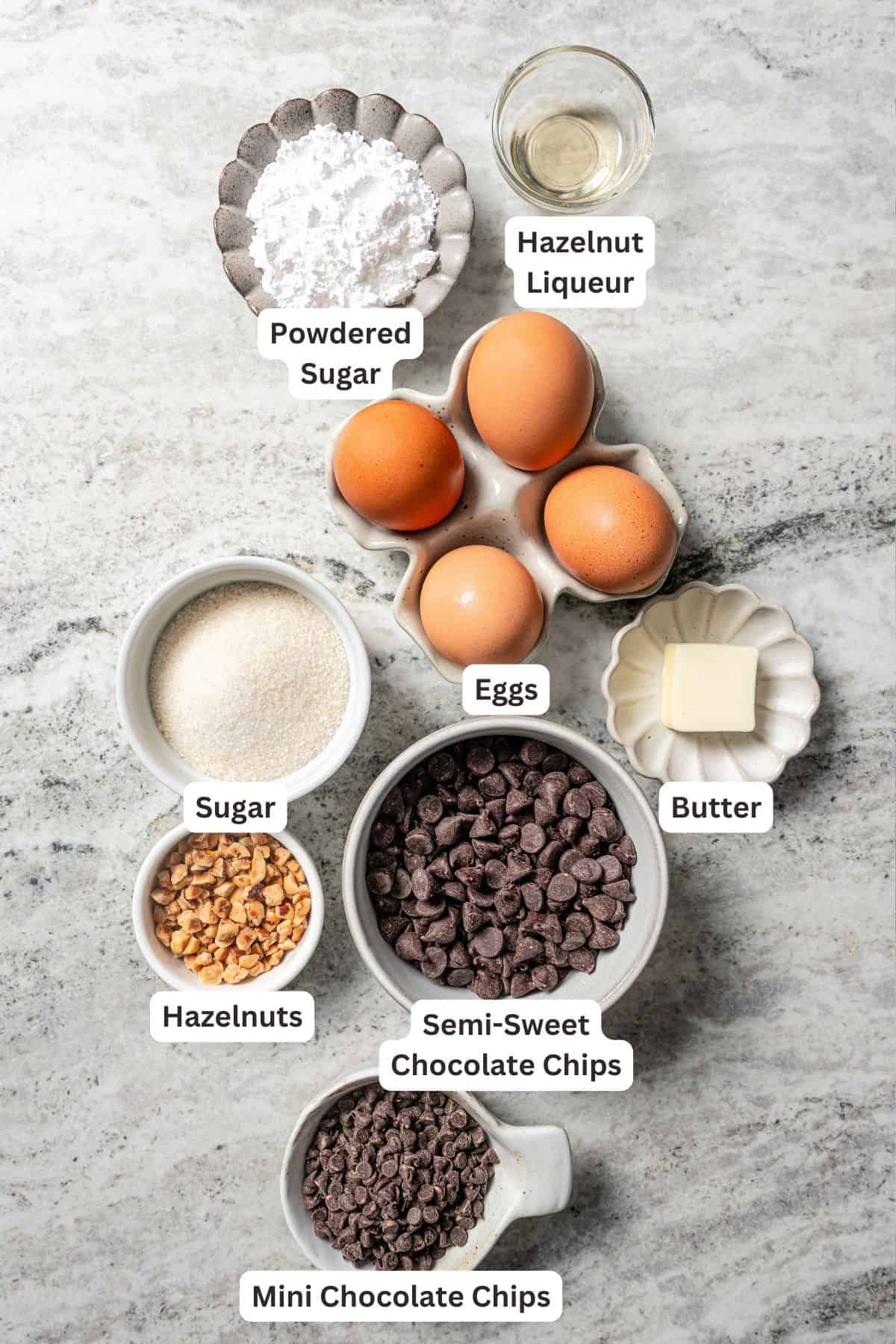 Chocolate souffle ingredients with text labels overlaying each ingredient.