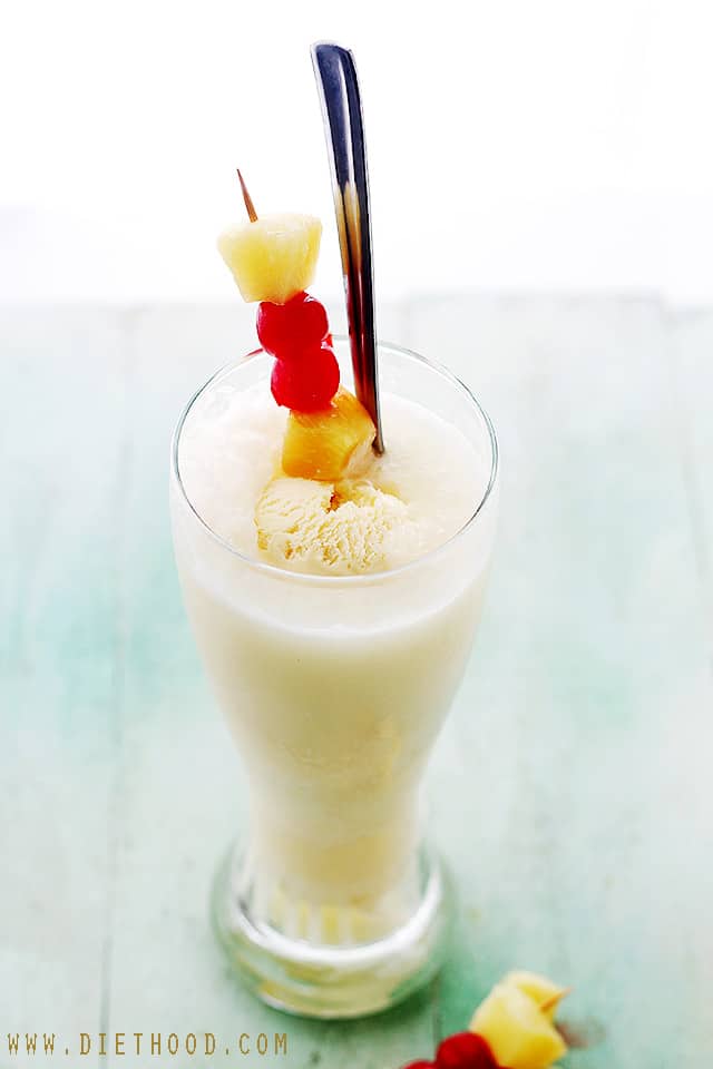Pina Colada Floats served in a tall glass.