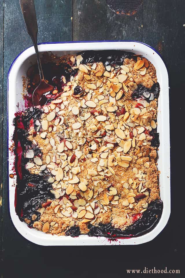 Strawberry Blueberry Crumble in a white pan.