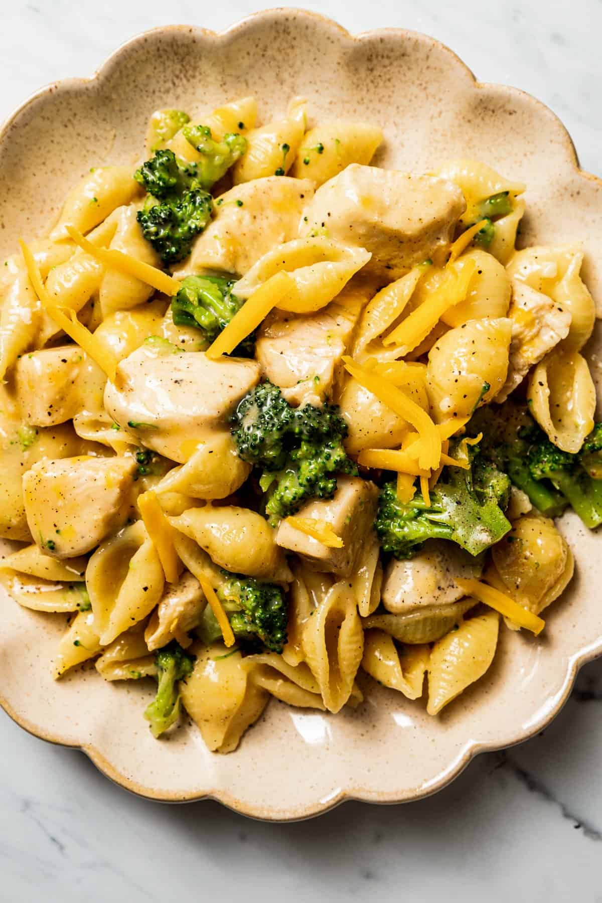 Close up of chicken and broccoli pasta on a plate.