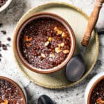 Overhead view of a chocolate souffle in a ramekin.