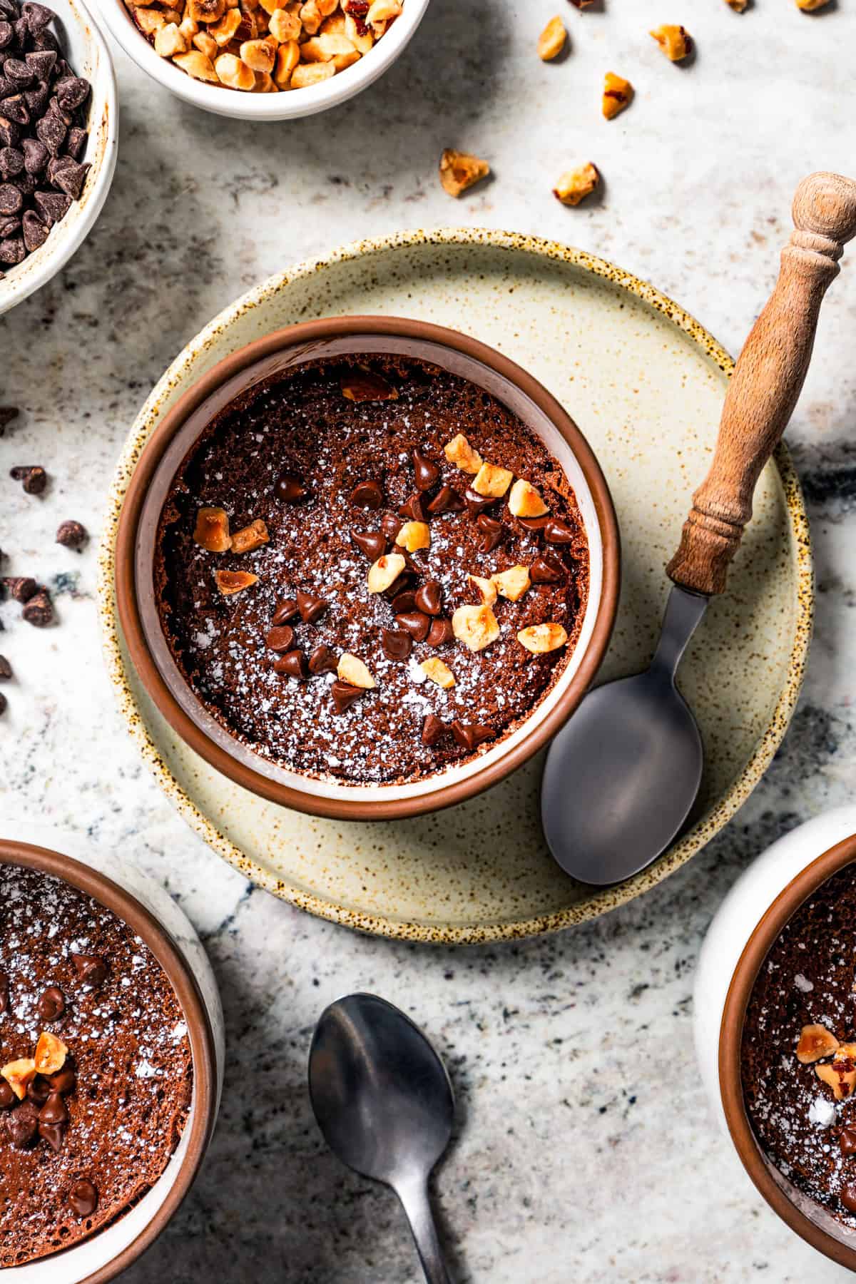 Overhead view of a chocolate souffle in a ramekin.