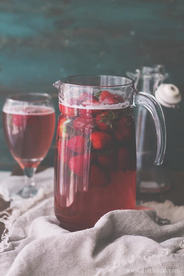 A pitcher with strawberry juice.