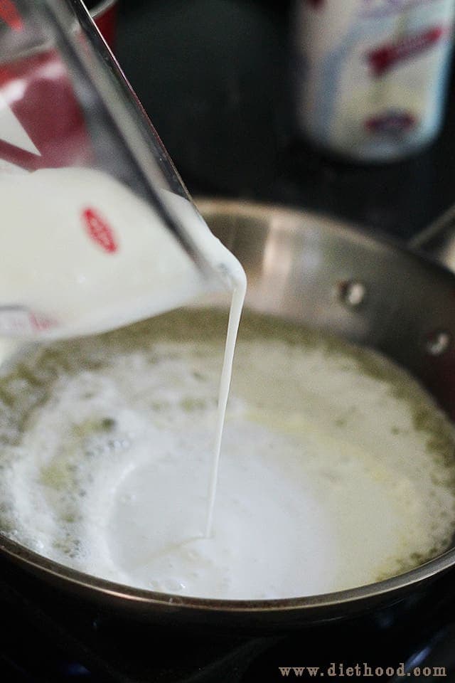 pouring milk in a skillet.