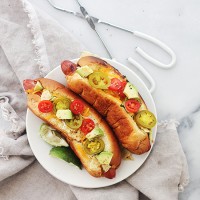 Nacho Hot Dogs | www.diethood.com | Cheesy and crunchy Nacho Hot Dogs packed with tortilla chips, jalapenos, avocado, tomatoes, and sour cream! | #hotdogs #recipe #grill