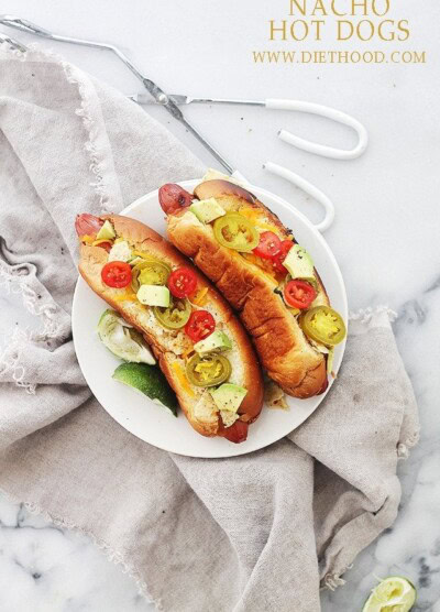 Nacho Hot Dogs | www.diethood.com | Cheesy and crunchy Nacho Hot Dogs packed with tortilla chips, jalapenos, avocado, tomatoes, and sour cream! | #hotdogs #recipe #grill