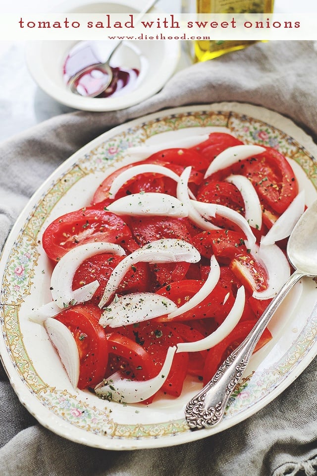 Tomato Salad with Sweet Onions served on an oval platter.