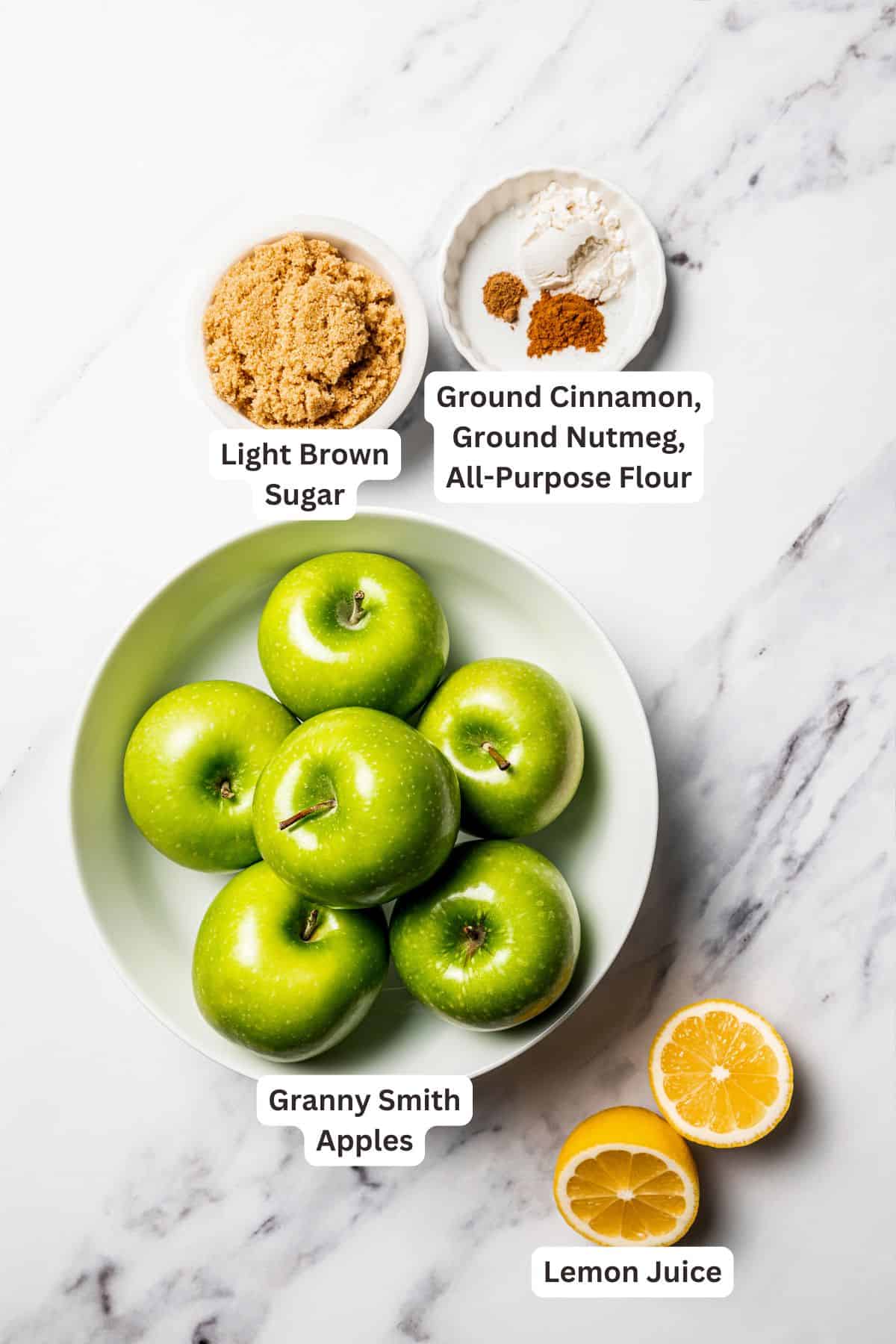 This apple pie cake has juicy caramel apples layered into a buttery crust, baked beneath a soft, sweet cake layer. It's easier than pie! Apple pie filling ingredients with text labels overlaying each ingredient.