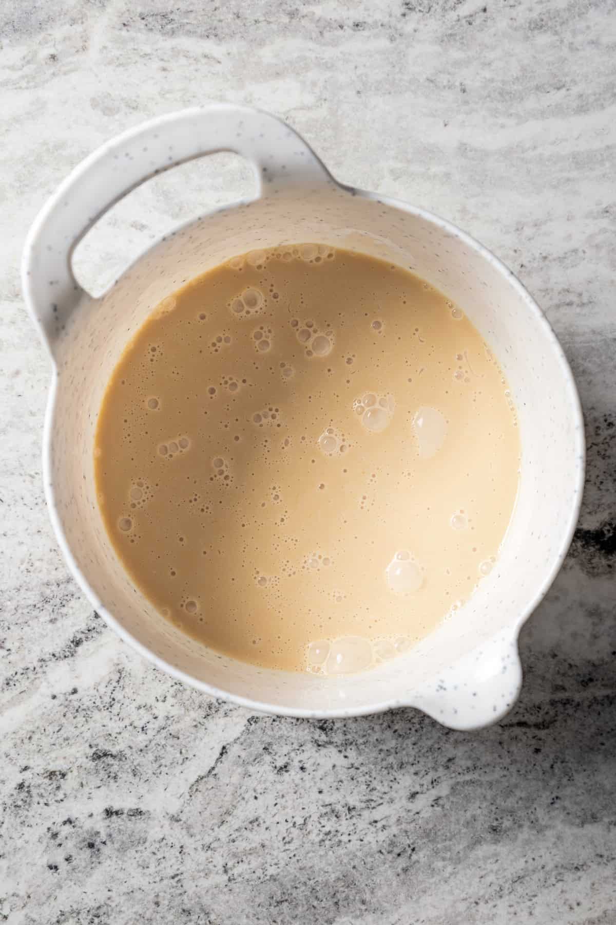 Coffee cream mixture in a white bowl.