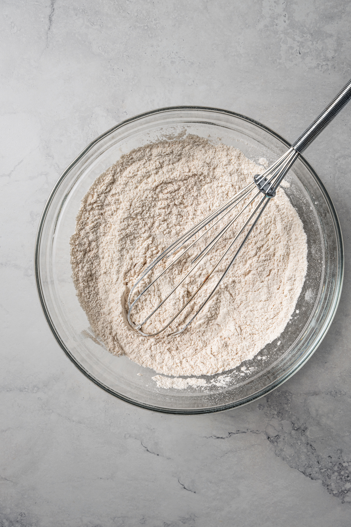 Dry ingredients whisked together in a bowl.