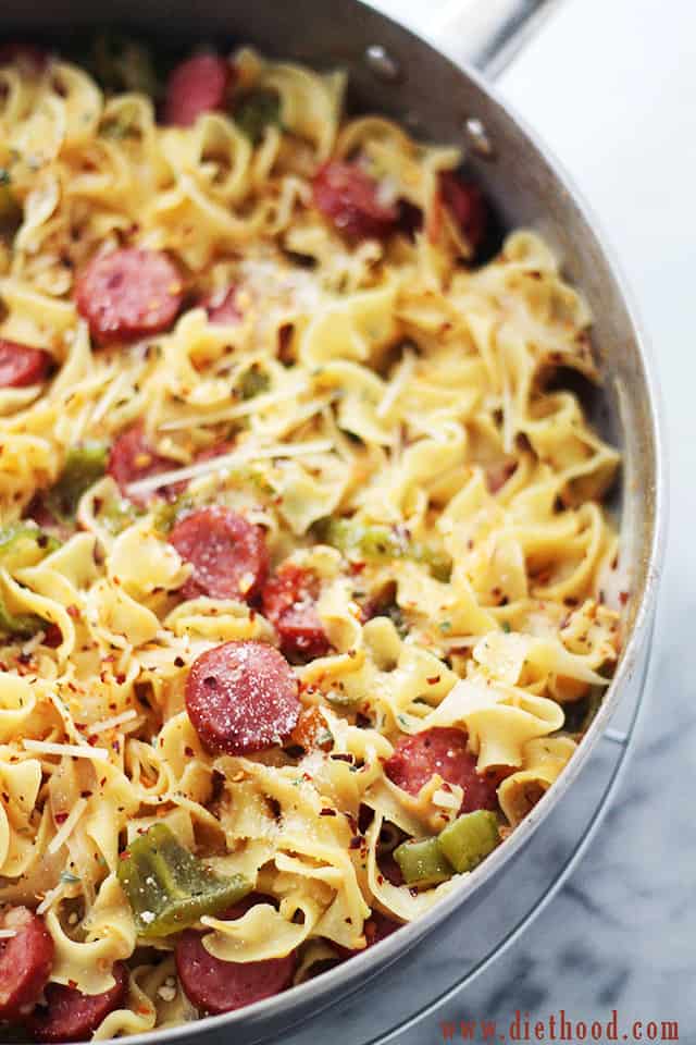 Image of egg noodles and sliced smoked turkey sausages.