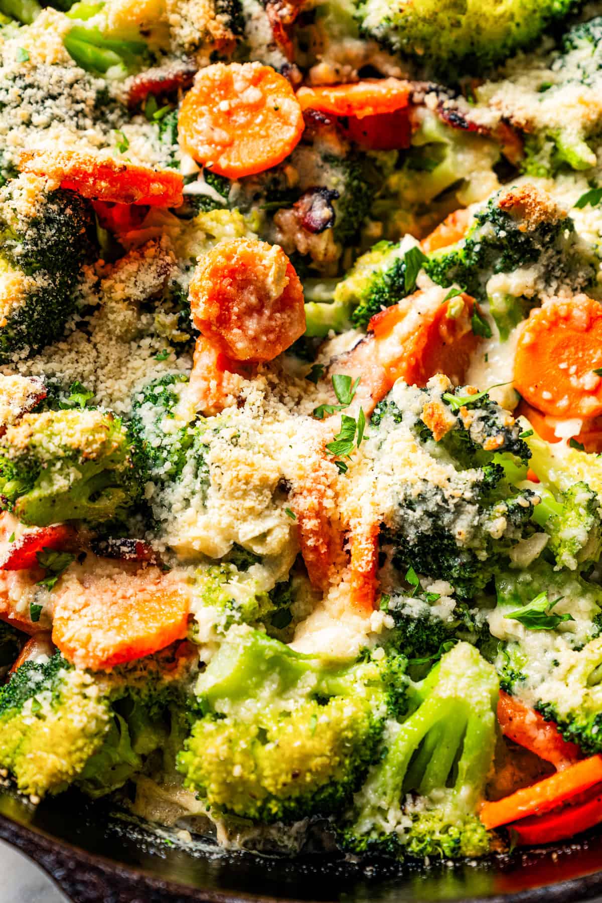 Close-up of broccoli and cheese side dish.