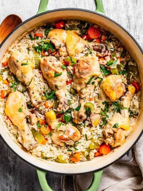 Overhead image of finished chicken and rice casserole in a large round baking dish.