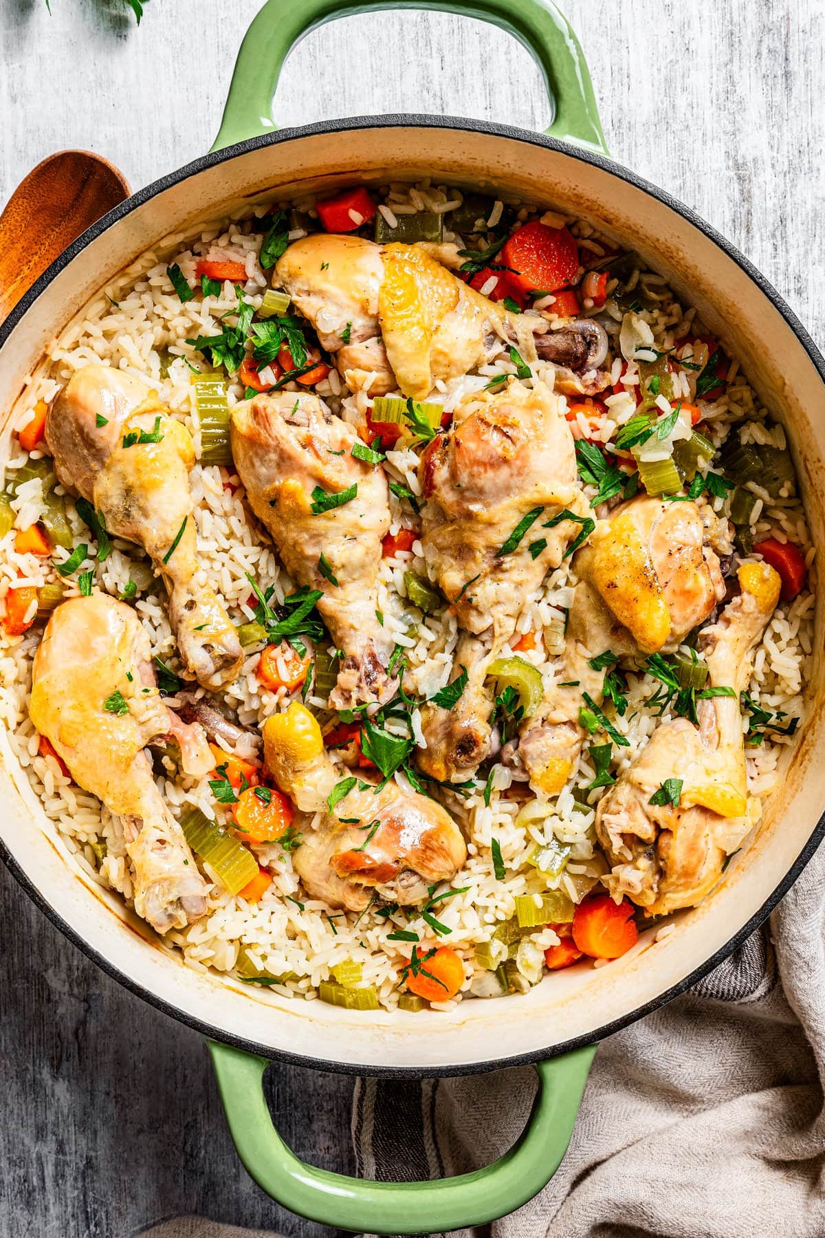 Overhead image of finished chicken and rice casserole in a large round baking dish.