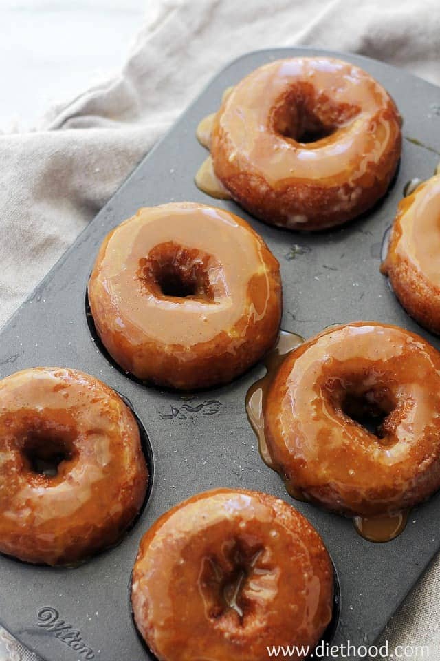 Baked Pumpkin Donuts in a pan, glazed with Salted Caramel