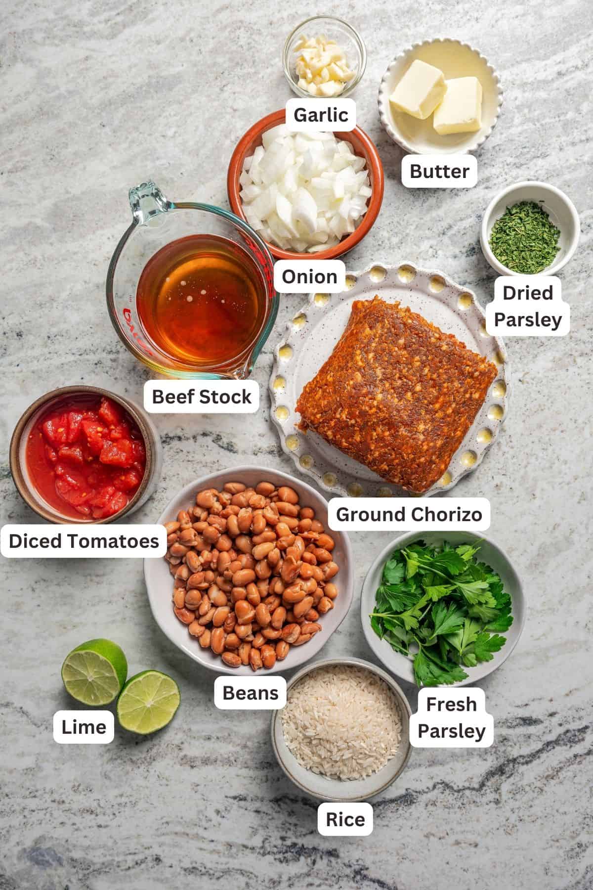 Ingredients for chorizo soup with text labels overlaying each ingredient.