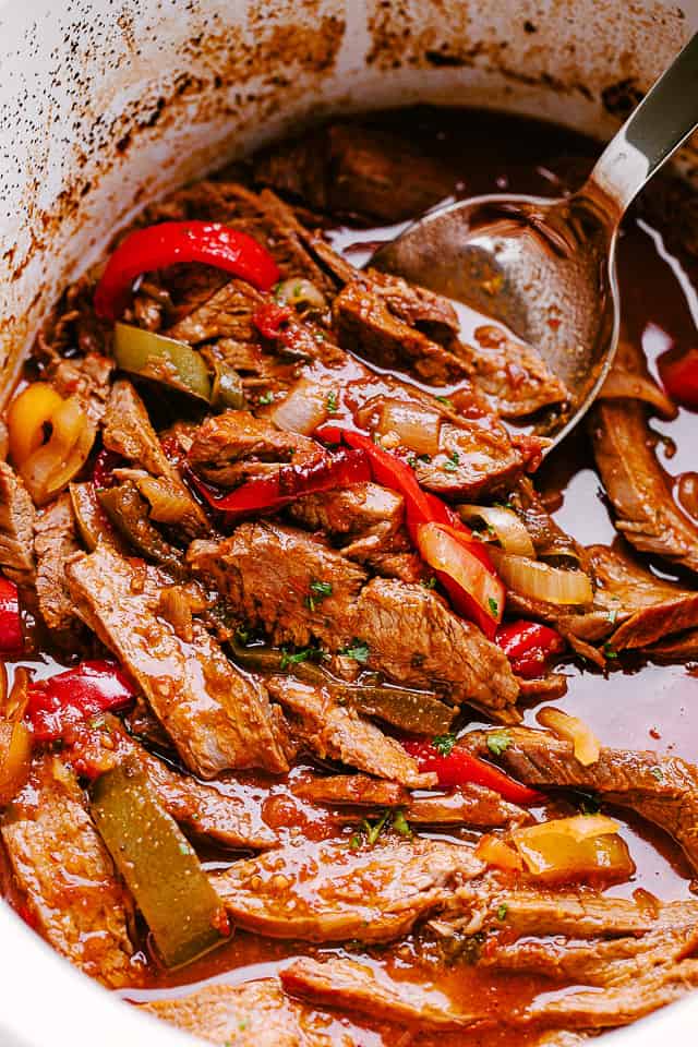 Shredded beef in crock pot.