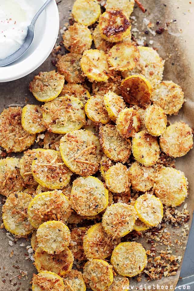 Garlic Parmesan Squash Chips on a light brown backdrop.