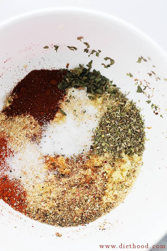 A bunch of seasonings in a white bowl.