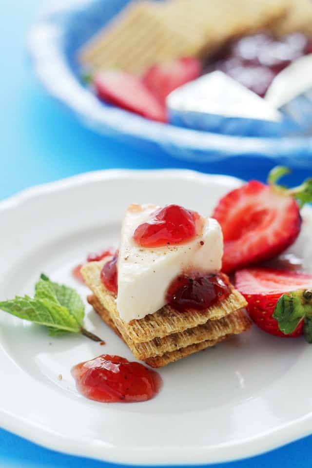 Strawberry Jam Cheese Wedges - Strawberry Jam atop cheese wedges served with crackers. 