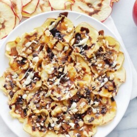 Caramel Apple Chips Nachos | www.diethood.com | Crispy, homemade Apple Chips topped with caramel, melted chocolate, and peanuts.