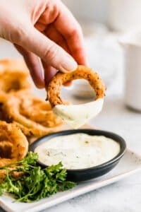 Onion ring with dip on it.